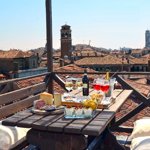 Head up to the roof terrace for a glass of wine as the Venetian sun begins to set