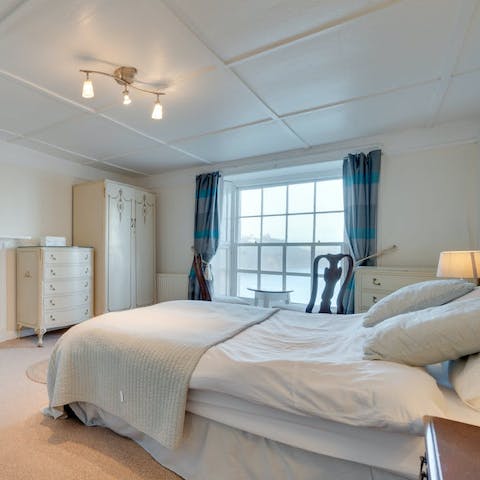Wake up each morning in the main bedroom to the sight of the sea