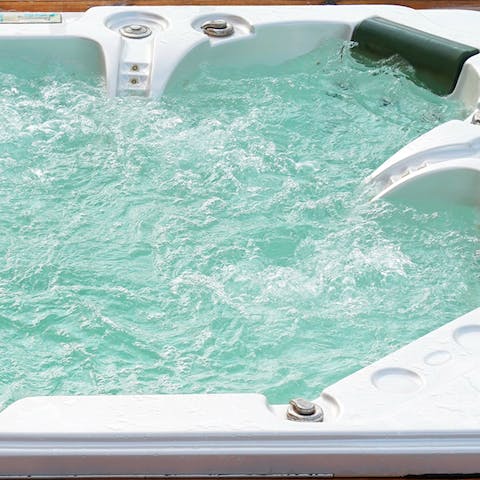 Take a long, luxurious soak in the private outdoor hot tub