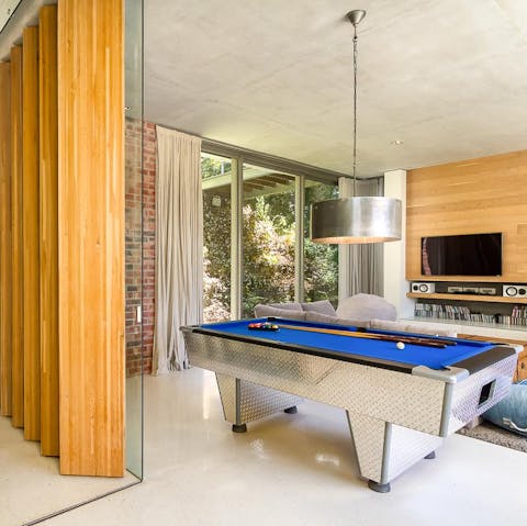 Challenge your loved ones to a game or two of pool on the one-of-a-kind pool table