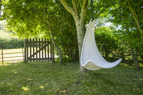 Savour your morning coffee on the hanging egg chair, catching up on your current read in the bucolic surroundings