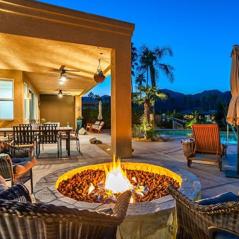 Warm up by the fire pit on cool desert evenings 