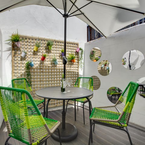 Take cocktail hour out onto the terrace
