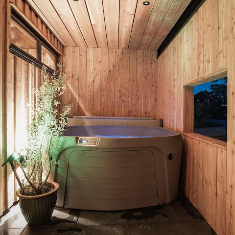 Treat yourself to a soak in the private hot tub
