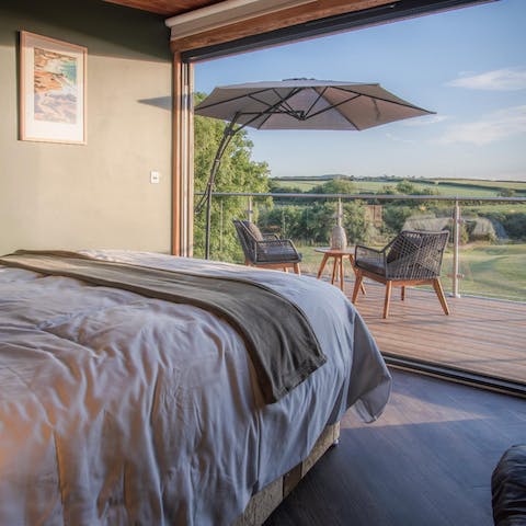 Wake up to stunning countryside views from the comfort of your bed