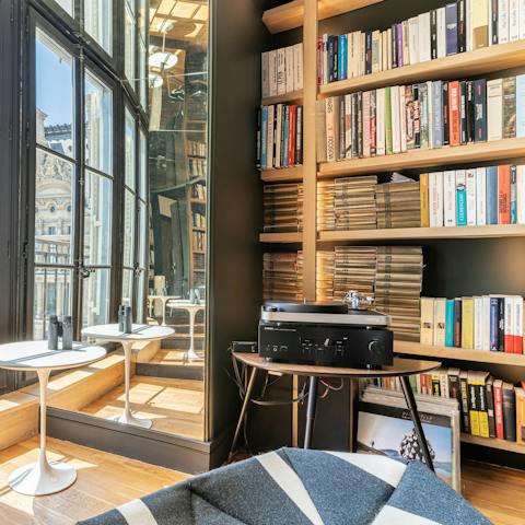 Play a record on the turntable as you peruse the bookshelves