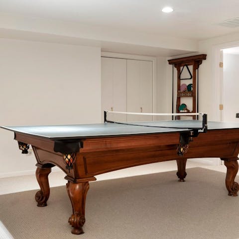 Get competitive over a game of ping pong in the games room 
