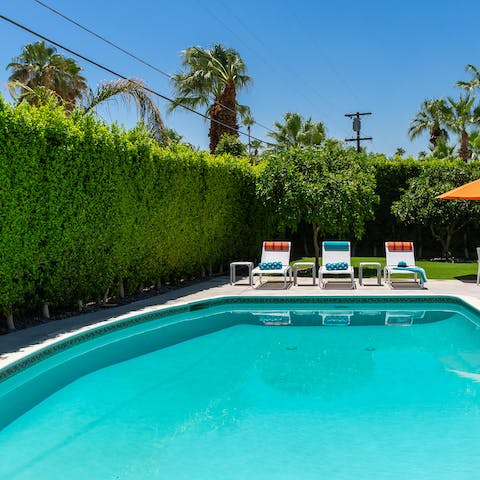 Jump into the invitingly blue swimming pool and retire to a lounger after a dip