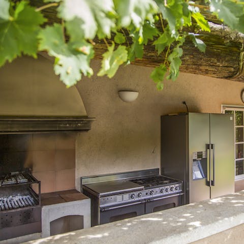 Gather the freshest local ingredients to prepare dinner in the outdoor kitchen