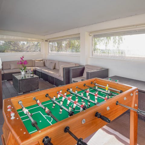 Take a break from swimming to play a game or two of table football