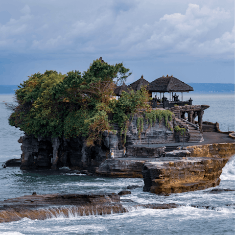 Visit the religious site of Pura Tanah Lot – it's a thirty-minute drive