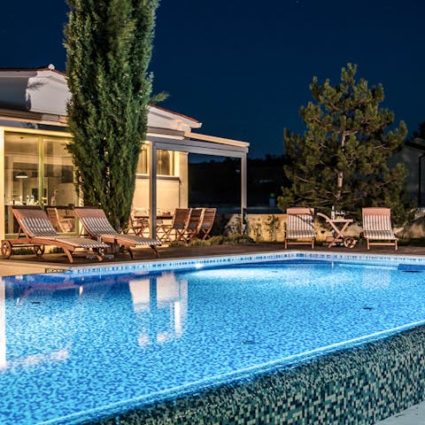 Take a midnight dip in the strikingly lit pool