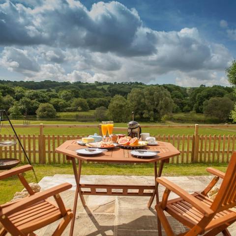 Lunch alfresco with views over an Area of Outstanding Beauty