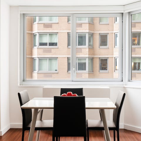 Sit down for a meal together in the dining nook, framed by large windows
