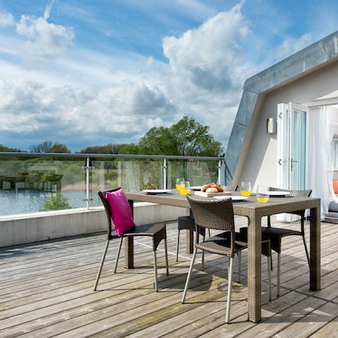 Savour the views across Swillbrook Lake while dining on the terrace