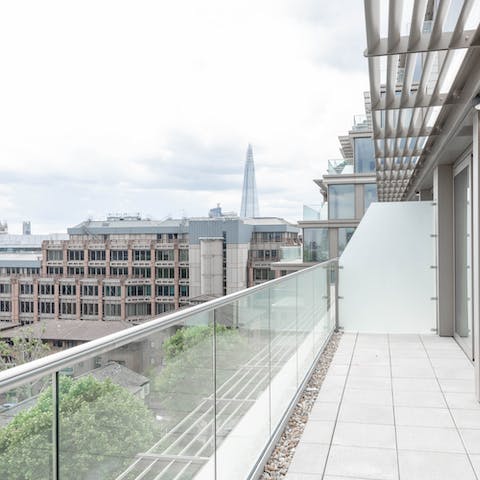 Step out onto the private balcony and take in the views of the city
