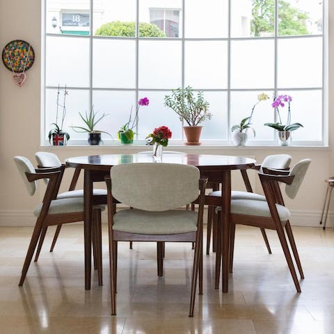 Host a dinner party around the mid-century modern dining table