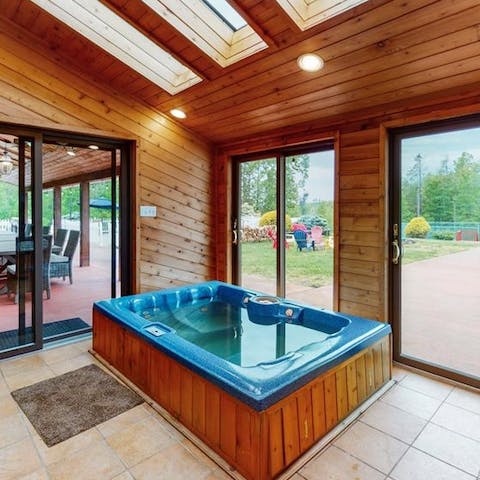 Relax and unwind in the luxurious hot tub 