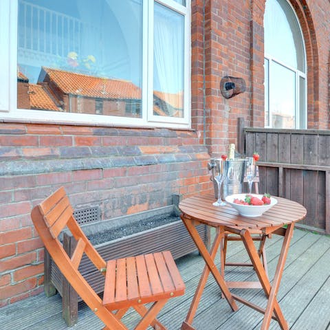 Sit back and relax with a glass of bubbly on your private patio