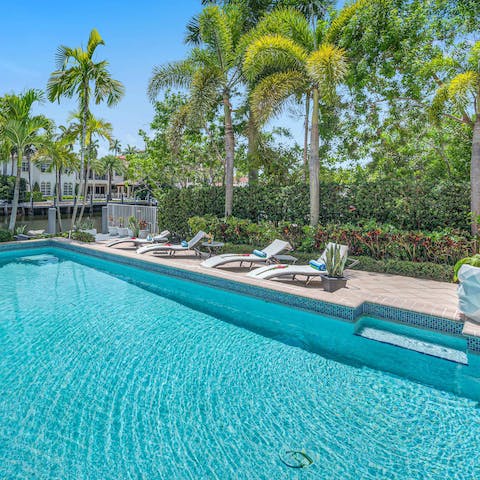 Embrace the tropical weather by taking a refreshing dip in the pool