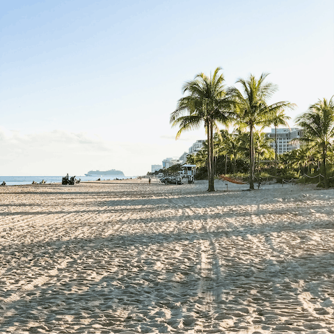 Walk or drive to Sebastian Street Beach and relax under the palms