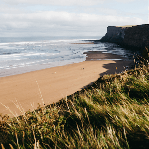  Feel the  sand against your feet on Gullane Beach – a twelve-minute walk
