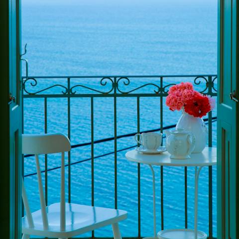 Gaze out at the beautifully blue Aegean Sea from the bedroom's balcony