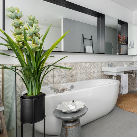 Treat yourself to a soak in the main bedroom's in-suite bathtub