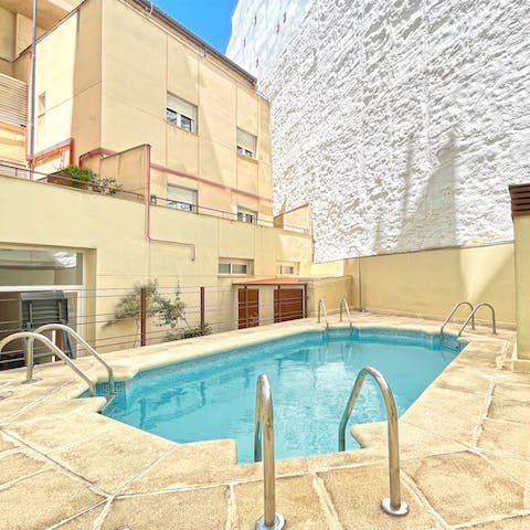 Take a refreshing dip in the building's shared swimming pool