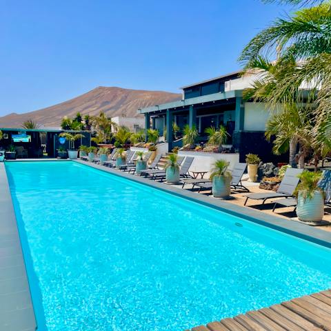 Take a dip in the pool with a mountain backdrop