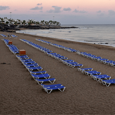 Hit the beach at Puerto Del Carmen – a ten-minute drive