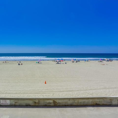 Take a stroll along Mission Beach and paddle in the shallow waters