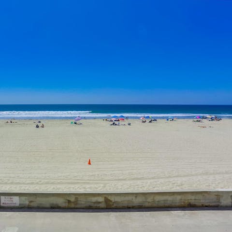 Take a stroll along Mission Beach and paddle in the shallow waters