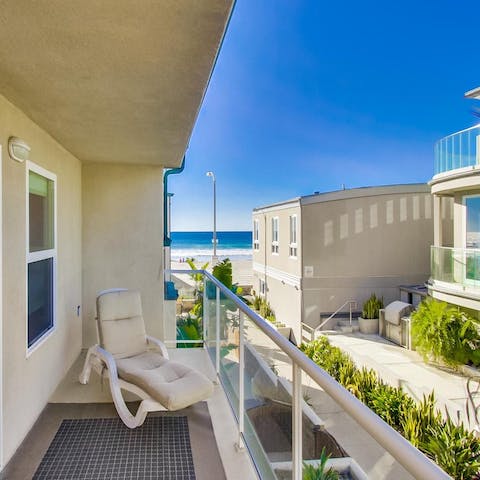 Retreat to the balcony and sink into the cushioned sun lounger