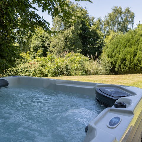 Switch on the lights on the hot tub at night and enjoy a glass of Sussex fizz
