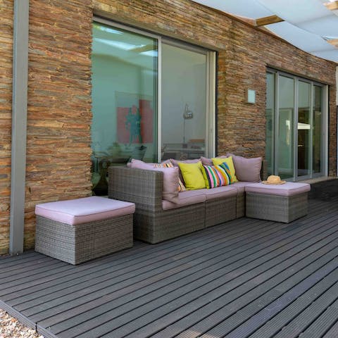 Take respite from the baking mid-day sun and stretch out on the outdoor sofa, catching up on your book