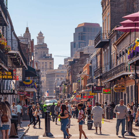 Immerse yourself in the vibrant atmosphere of Bourbon Street, which is only a sixteen-minute drive away