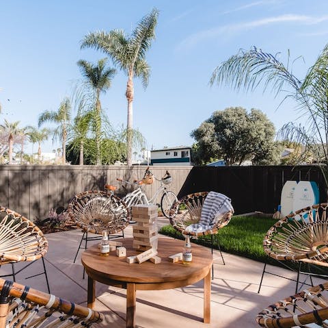 Relax in the pretty boho space with drinks in the sunshine