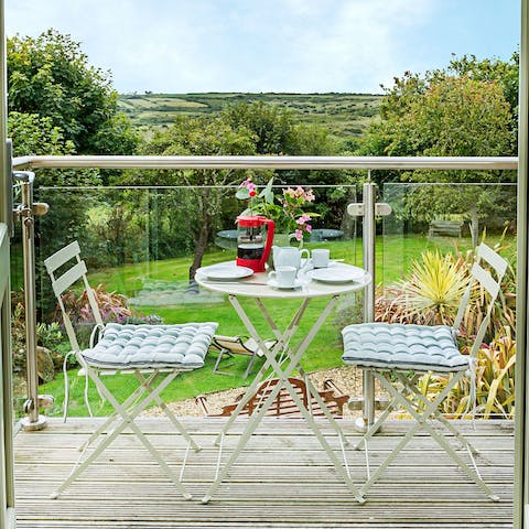 Bask in the fresh country air on the balcony, admiring the rolling views