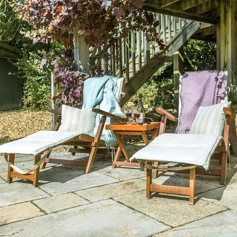 Lounge in the garden on sunny days with a good book and a glass of wine