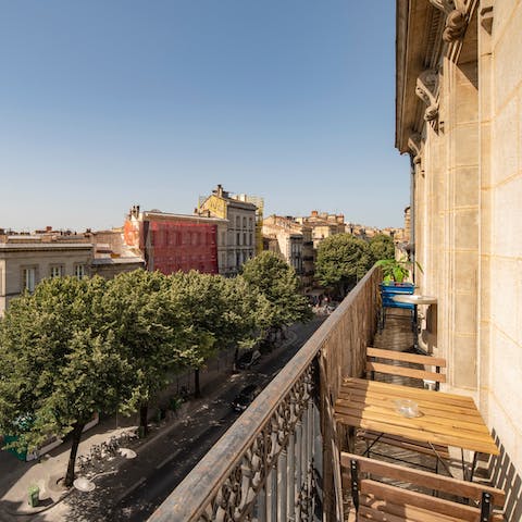 Enjoy a drink out on the balcony with fantastic views of the Bordeaux skyline before you