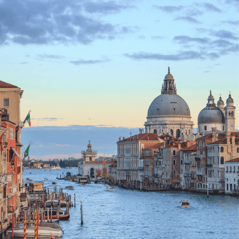 Float past majestic architecture and cultural landmarks on Venice's canals 