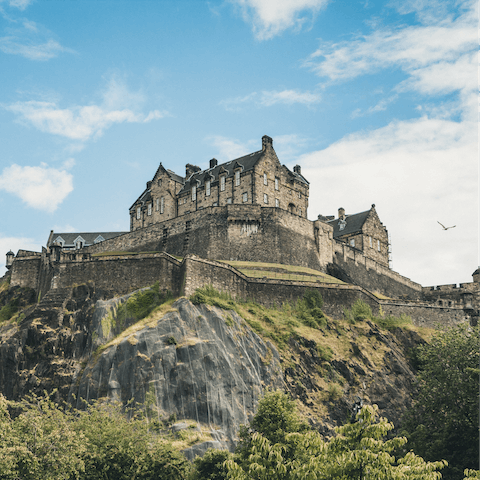 Visit Edinburgh Castle to learn more about the city's history, a twelve-minute stroll away