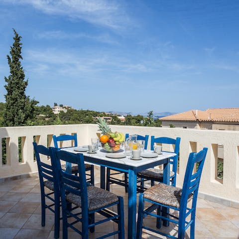 Dine at the taverna-style table on the rooftop terrace