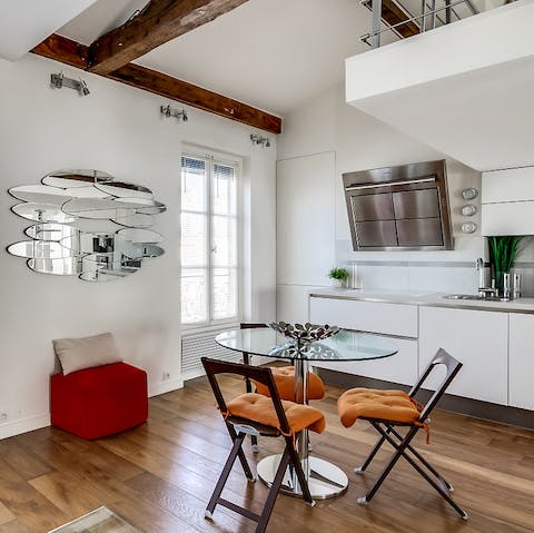 Look forward to waking up with breakfast in the sleek white and chrome living space