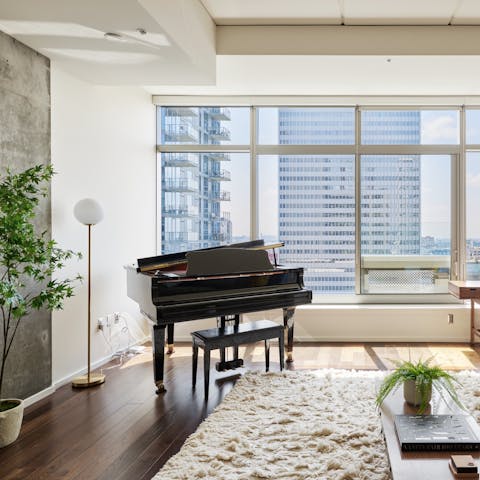 Admire the city views as you play the piano 
