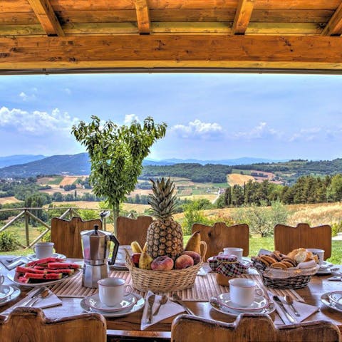 Start your day with breakfast on the covered terrace overlooking the Umbrian countryside 