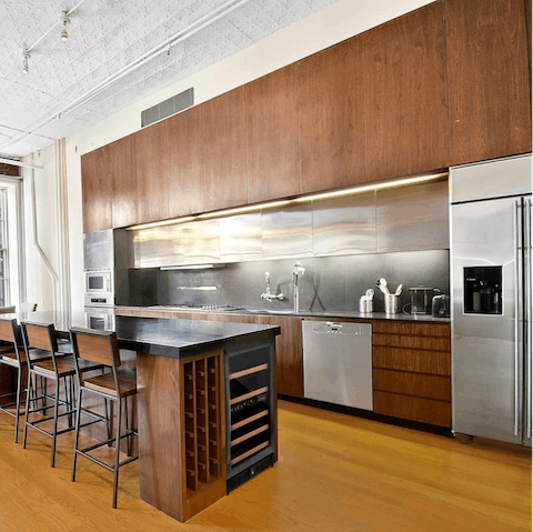 Cook up a storm in the open, industrial style kitchen