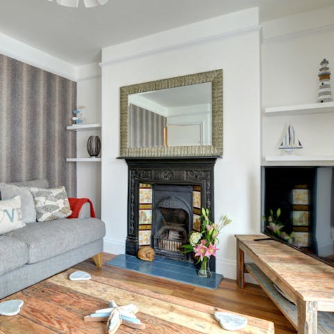 Admire the original fireplaces and features throughout