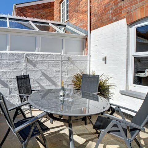 Sip an alfresco glass of wine on the back patio